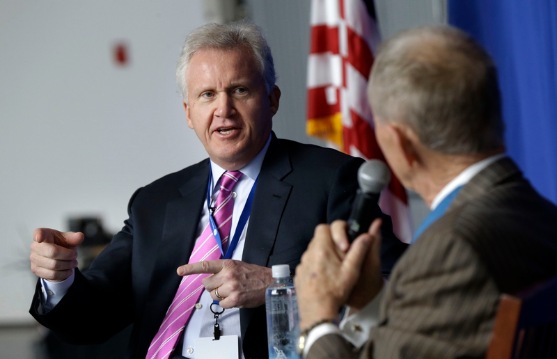 Jeff Immelt, Chairman and CEO of General Electric, left, talks with Medal of Honor recipient Major General James Everett Livingston during a question and answer session at the National World War II Museum in New Orleans, Tuesday, April 23, 2013 (AP Photo/Gerald Herbert)